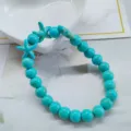 Exquisite turquoise beaded elastic bracelet featuring sea-inspired starfish charms - 3 Starfish