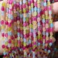 Gros plan de perles en pierre naturelle de couleur bonbon style tourmaline pour bijoux DIY. - Petites perles de riz 4*6,5 mm (env. 61 pcs)