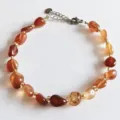 Natural irregular gemstone crystal bracelet with golden spacer beads and adjustable chain. - Red Agate