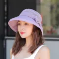 Close-up detail of women's purple lace sun hat, breathable design and elegant bow decoration. - One Size / Purple
