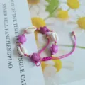 Handmade braided pink turtle shell bracelet with cute sea turtle charms and natural cowrie shells. - Purple Sea Turtle