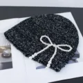 Black sequin knit beanie hat with elegant pearl bow decoration for autumn and winter fashion. - Pearl Strand Bowknot Style