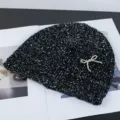 Black sequin knit beanie with a sparkling silver bow, cozy winter warm hat fashion accessory. - Rhinestone Bow Style