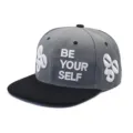 Close-up view of a stylish gray snapback cap featuring white 3D BE YOUR SELF embroidery. - Adjustable / Grey Black Patchwork Style (2)