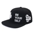 Macro detail of black American street style flat brim cap with 3D embroidery text - Adjustable / Solid Black Style (5)