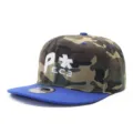 Detailed view of the camouflage snapback baseball cap with embroidered letters and flat blue brim. - Adjustable / Camouflage