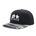 Detailed view of the black hip hop baseball cap with white embroidery and camo flat brim. - Adjustable / Black