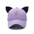 Close-up detail of purple fashion baseball cap featuring cute black cat ears and star charms. - Adjustable / Pentagram / Purple