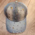 Close-up detail of denim baseball cap embellished with metallic studs and star rivets. - Adjustable / Light Blue Star Rivet Style (01)