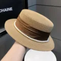 Chic straw boater hat for women featuring brown ribbon and pearl trim for stylish summer wear. - 7cm Brim / Khaki