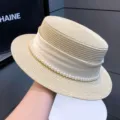 Elegant straw boater hat for women, featuring a chic white ribbon and pearl trim for summer sun. - 7cm Brim / Off White