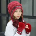 Red knitted winter hat with earflaps and matching faux fur gloves shown on model - Set / One Size Stretchy / Burgundy