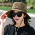 Detailed outdoor sun hat detail featuring a wide brim and adjustable chin strap design. - Wide Brim Drawstring Bucket Hat / One Size / Army Green