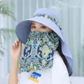 Close-up detail of the wide-brim sun hat with removable face cover and stylish paisley print. - M (56-58cm) / Light Blue