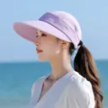 Closeup view of a stylish light purple empty-top sun visor hat, perfect for outdoor summer wear. - One Size / Purple