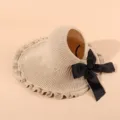 Beige knitted empty top sun hat with black bow and ruffled wide brim for women summer travel - Adjustable / Beige