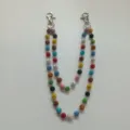 Detailed view of a 12mm colorful rhinestone bead pants chain featuring secure metal clasps - Style 53