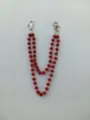 Detailed view of a 12mm red rhinestone double-strand chain with silver lobster clasps. - Style 6