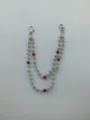 Detail view of 12mm silver and red rhinestone clay ball double-layered pant chain - Style 2