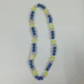 Detailed view of the colorful beaded cross necklace with sparkly crystal balls and elastic cord. - 10mm Beads, Approx 56 Beads, 54cm (21.25inch), 5 Rows / Blue, Silver and Yellow Cross (8)
