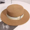Stylish straw boater hat for women, featuring a chic ribbon and metal M charm for summer beach. - One Size / Khaki