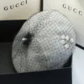 Detailed view of grey wool beret with black mesh veil and floral crystal accent - Adjustable / Gray