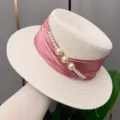 Detail shot of summer straw hat with pink ribbon and pearls, perfect for elegant sun protection. - Adjustable / Creamy White Hat Body Pink Ribbon