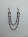Close-up of 12mm sparkling purple and silver pave disco ball beads on a pants chain - Style 15