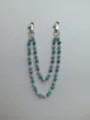 Detailed view of the double-layered blue and white rhinestone ball chain with silver clasps. - Style 19