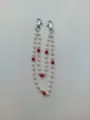Detailed view of beaded chain with white rose patterns and red rhinestone balls - 10mm 5-Row Rhinestone Disco Balls / Style 42