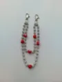 Detailed shot of hip-hop pants chain featuring silver rhinestone beads and red billiard balls - Style 43