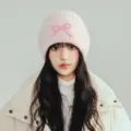 Pink knit beanie for women, cute bow decoration, warm winter knitted cap, cozy fashion hat. - One Size / Pink