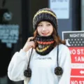 Black and white speckled knitted beanie hat with yellow stripes and matching neck warmer - Black