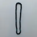 Detailed view of the Shamballa rhinestone clay bead necklace with black and blue crystal balls. - 10mm (5 Rows) / Black and Teal (3)