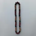 Close-up detail of sparkling rhinestone clay beads strand in red, black and bronze colors. - 10mm (5 Rows) / Red, Black and Bronze (1)