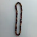 Detailed closeup view of the sparkling red, black, and gold crystal shamballa beaded necklace. - 10mm Beads, 54cm (5-Row Rhinestones) / Red Black Gold Tri-color (46)