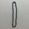 Detailed view of the black and silver rhinestone Shamballa clay bead necklace flat lay. - 10mm Beads, Approx 56 Beads, 54cm(21.25inch), 5 Rows / Style 23
