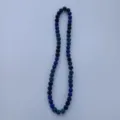 Detailed close-up view of the sparkling blue rhinestone clay bead necklace details. - 10mm (5 Rows / 54cm) / Blue & Black (55)