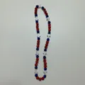 Detail view of the red and blue rhinestone shamballa bead necklace featuring white cross spacers. - 10mm Beads, approx. 56 Beads, 54cm, 5 Rows / Color 88