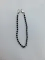 Close-up view of the black crystal pave bead chain featuring sturdy silver lobster clasps. - 10mm 5-Row Rhinestone Disco Balls / Style 3