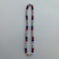 Detail view of the colorful rhinestone shamballa bead necklace with red white and blue stones. - Elastic Necklace / 10mm Beads, approx. 56 Beads, 54cm, 5 Rows / Red White and Blue Mix (123)