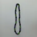 Detailed view of the sparkling purple and green clay rhinestone bead necklace with black cross charms. - 10mm Beads, Approx 56 Beads, 54cm(21.25inch), 5 Rows / 98