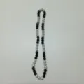 Detailed close-up view of the black and white rhinestone Shamballa crystal ball bead necklace. - 10mm Beads, Approx 56 Beads, 54cm (21.25in), 5 Rows / Style 100