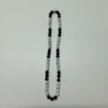 Detailed view of black and white rhinestone shamballa beaded necklace with elastic design. - 10mm Beads, Approx 56 Beads, 54cm (21.25in), 5 Rows / Style 101