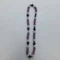 Detail view of the beaded necklace featuring pink and silver rhinestone balls with black cross accents. - 10mm Beads, Approx 56 Beads, 54cm(21.25inch), 5 Rows / 119