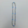 Detail shot of the rhinestone paved ball beads and light blue cross necklace accessory strand. - 10mm Beads, Approx 56 Beads, 54cm(21.25inch), 5 Rows / No.50