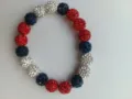 Detailed close-up of a 10mm red, white, and blue rhinestone Shamballa elastic bracelet. - No.23