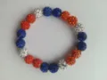 Close-up detail of a 10mm clay disco ball bead baseball bracelet in red, white, and blue colors - No. 18