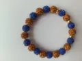 Blue and gold rhinestone clay shamballa bead bracelet detail shot, elastic string. - Size 11