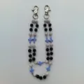 Double layer hip hop pants chain featuring black and white rhinestone pave balls and blue cross charms. - Style 27